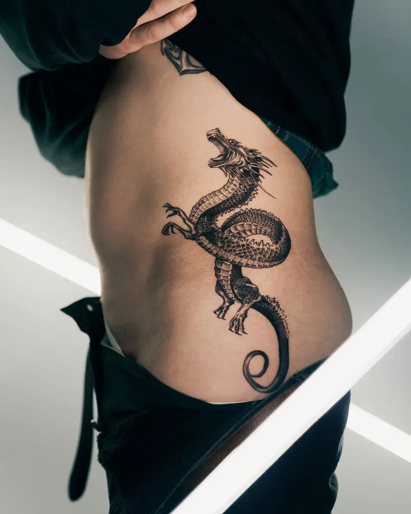 11. Roaring Dragon Rib Tattoo