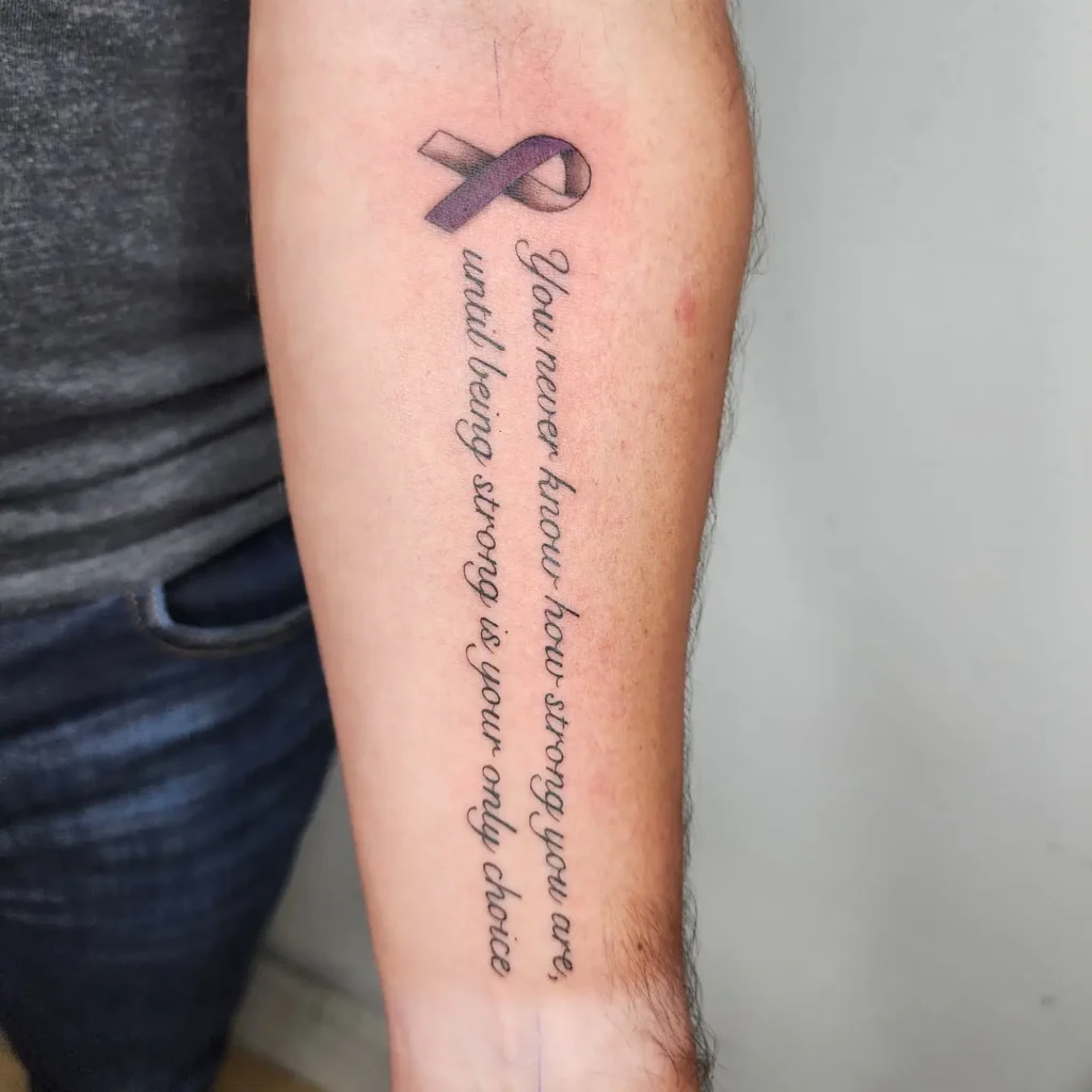A delicate forearm tattoo in cursive script with the word “breathe,” symbolizing mindfulness, calm, and anxiety relief.