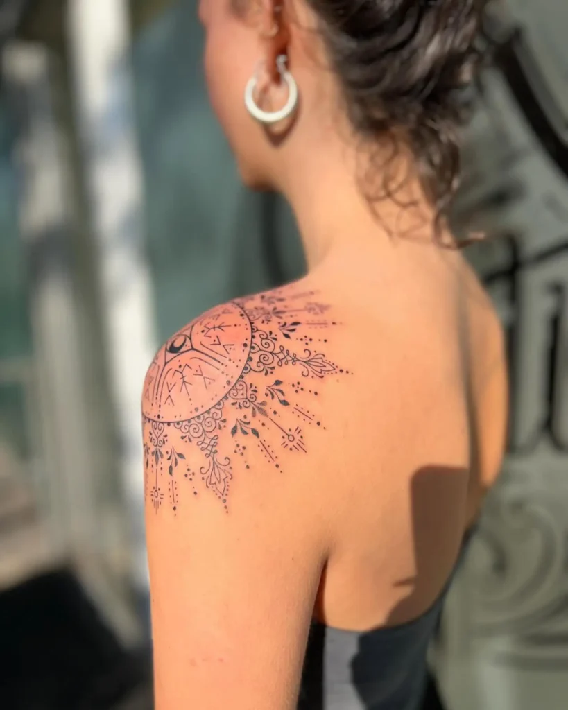 18. Ornate Mandala Sunburst Shoulder Tattoo