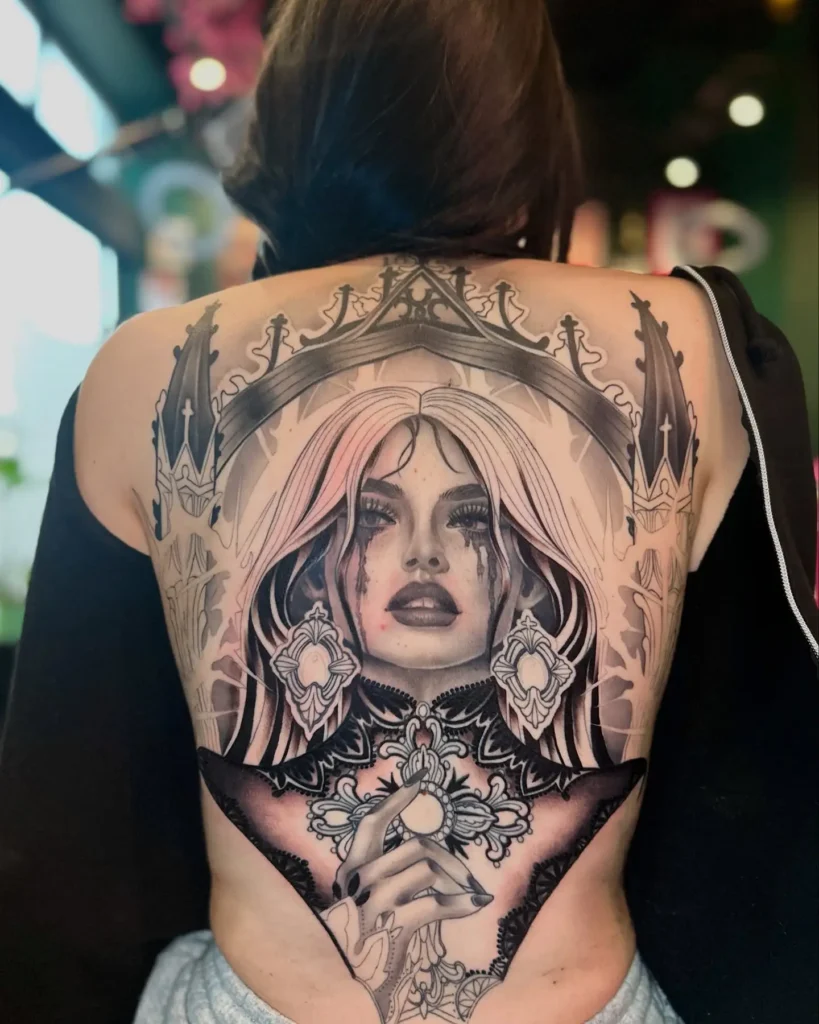 Gothic queen full-back tattoo with cathedral design, emotional expression, and dark ornamental detailing

