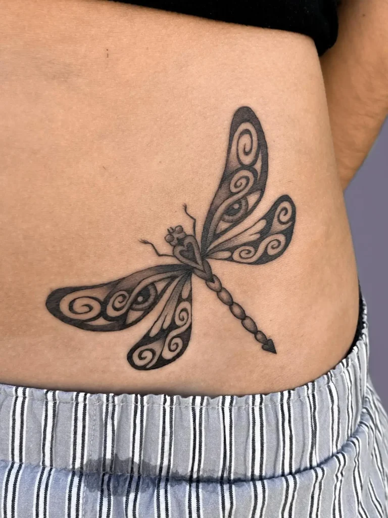 Playful Dragonfly Hip Tattoo