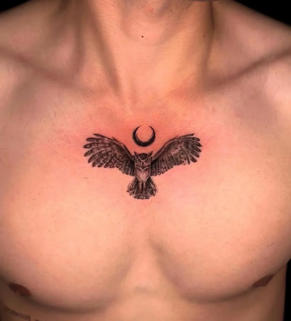 Black ink owl tattoo on the chest with wings spread wide and a crescent moon above its head. Positioned centrally with balanced symmetry and detailed feather shading. Represents insight, wisdom, and night energy. A striking choice for animal tattoo ideas chest or upper body, blending simplicity with powerful symbolism.








