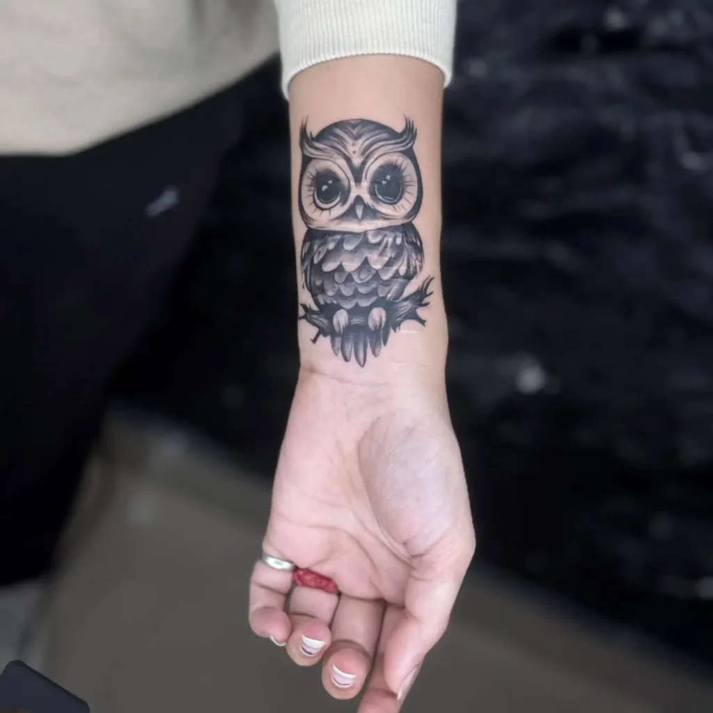 Realistic owl tattoo on the inner arm featuring sharp eyes and dark shading. Designed in black and grey with fine feather details. Symbolizes wisdom and awareness. Great for animal tattoo ideas arm-focused placements that are simple yet visually commanding.









