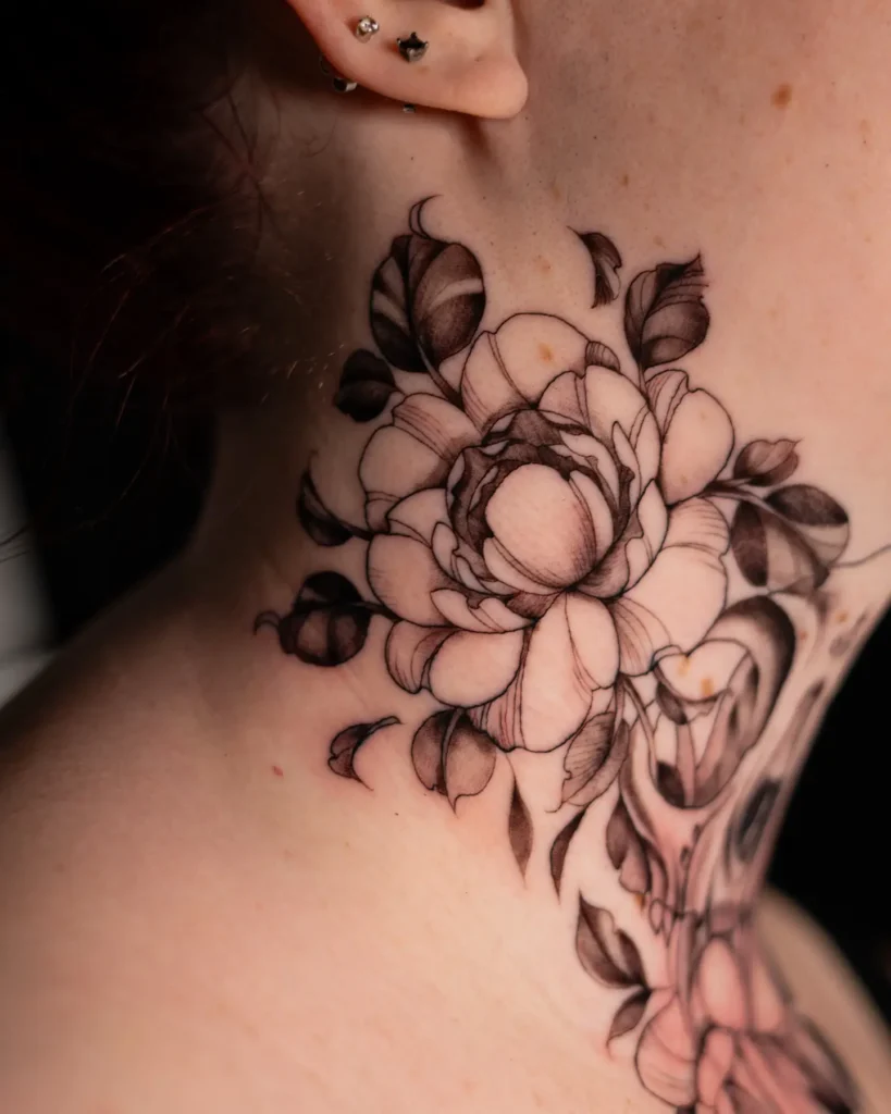 Realistic floral neck tattoo for women with soft shading and large blooming petals on the side of the throat.