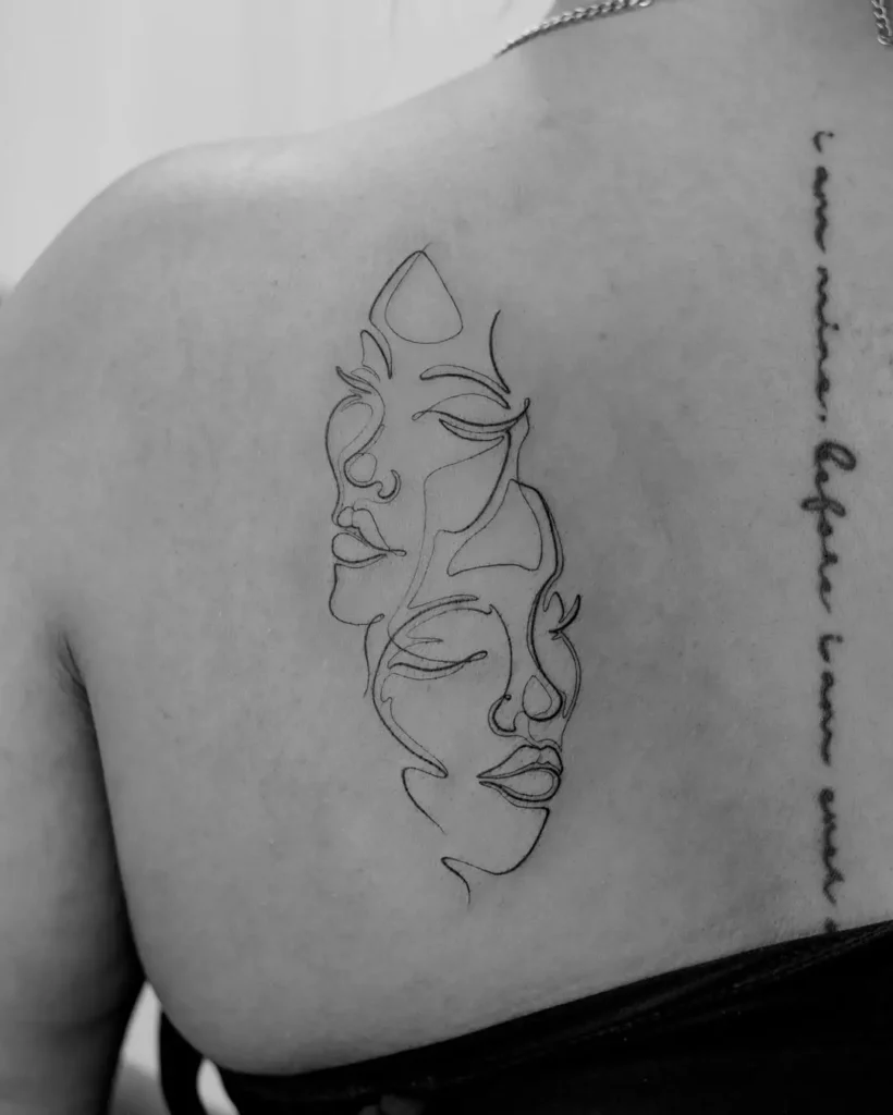 Continuous line tattoo of two abstract female faces in fine black ink, placed on the upper back for a minimalist and symbolic look.

