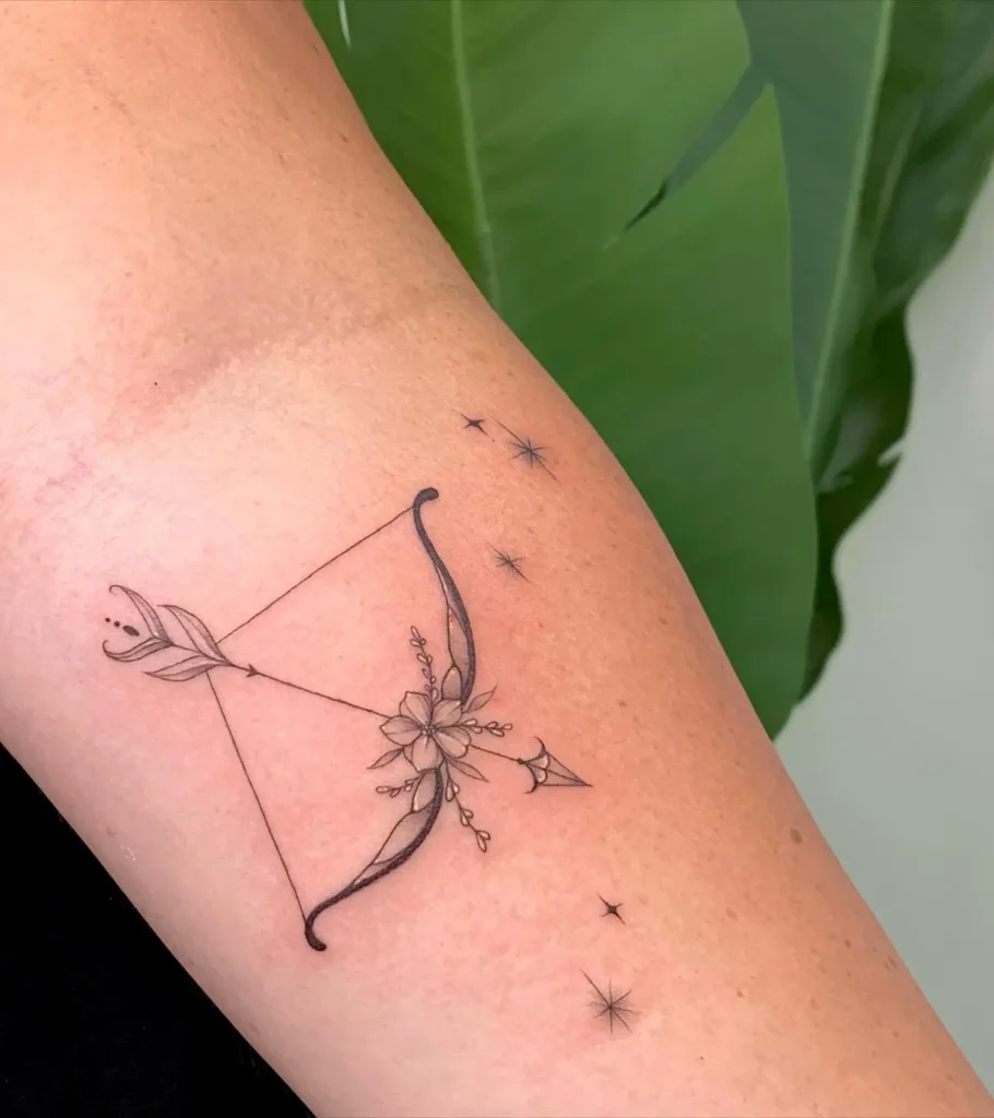 1. Floral Bow and Arrow Tattoo