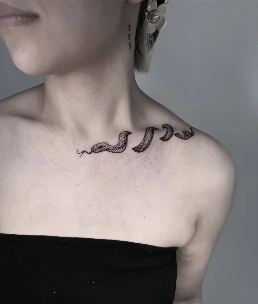 1. Snake Coil Collarbone Tattoo