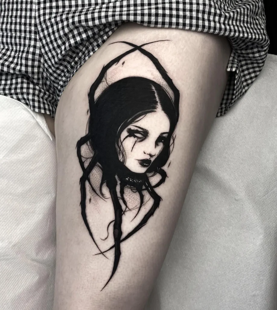 10. Gothic Widow Face Thigh Tattoo