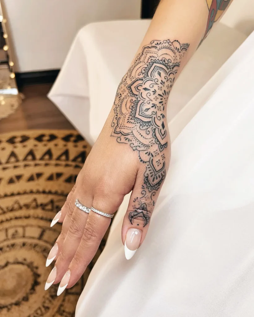 10. Intricate Hand Mandala Tattoo