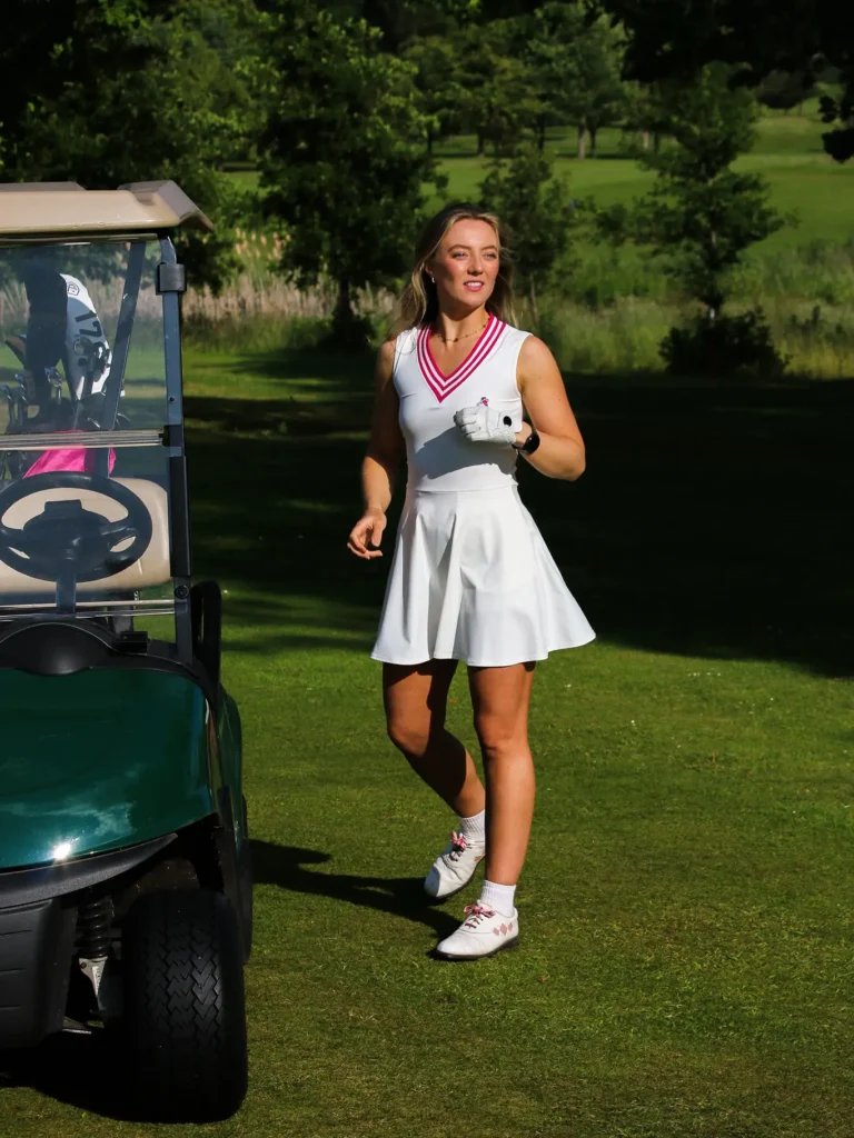 10. Varsity Vibes with Sleeveless White Dress