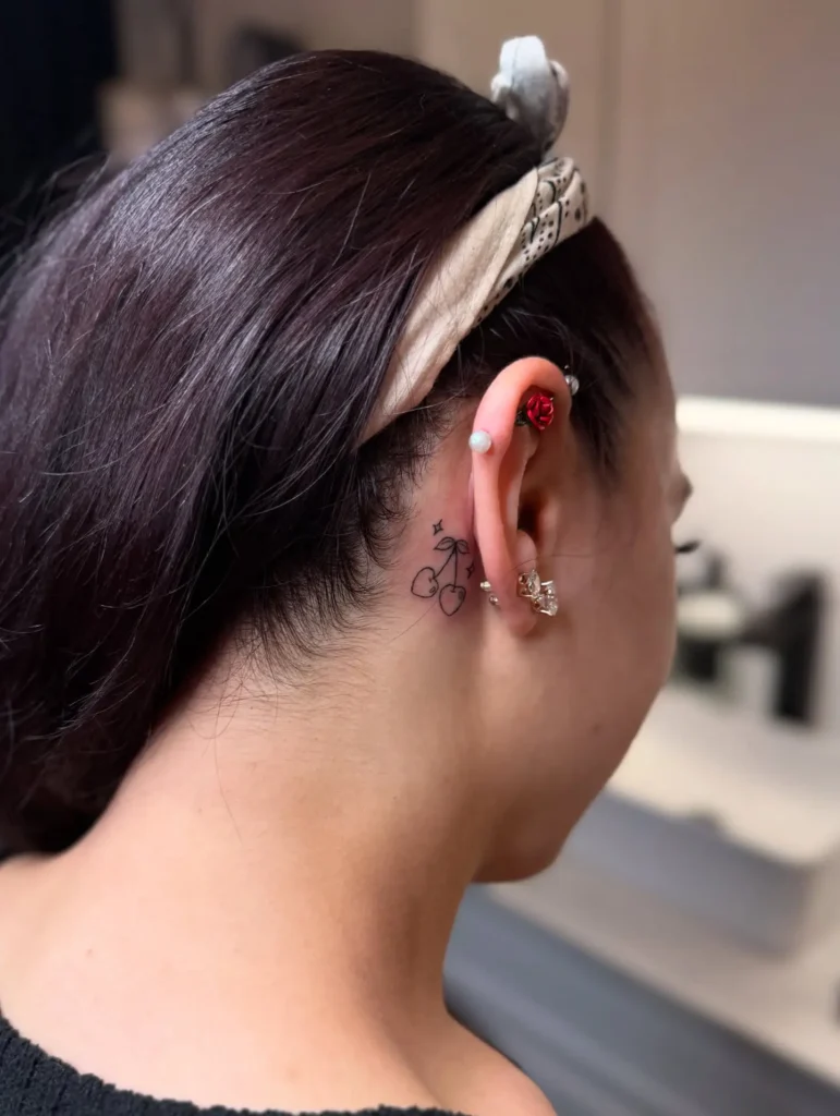 11. Cherry Hearts Behind the Ear Tattoo