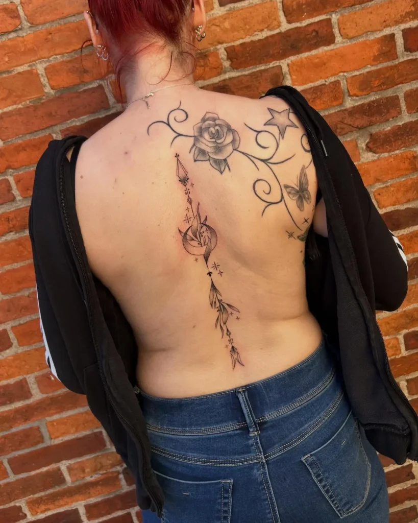 11. Ornamental Spine Arrow Tattoo