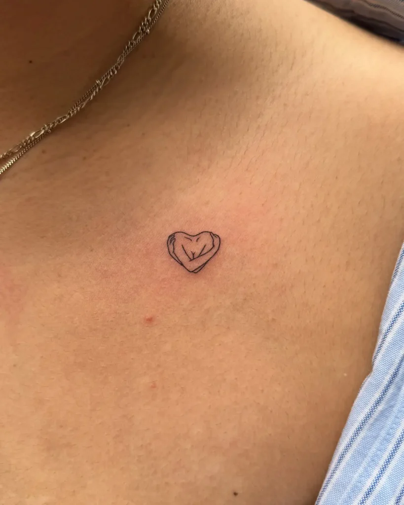 13. Hand Heart Line Art Tattoo on Collarbone