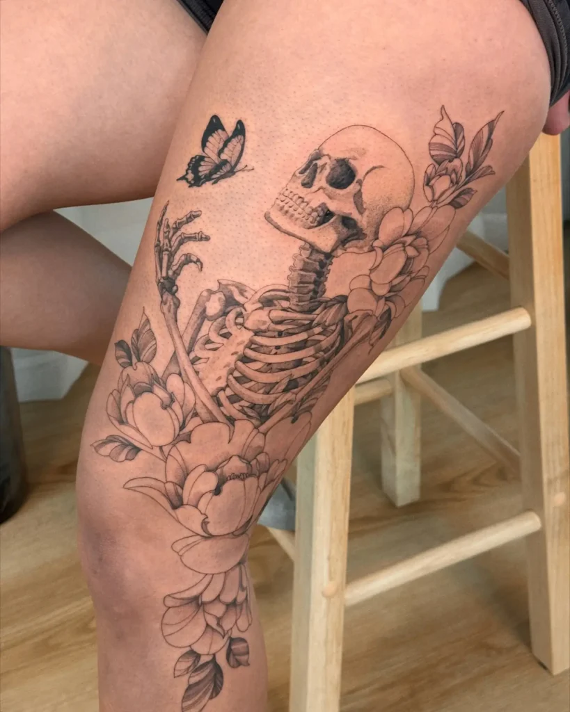 13. Skeleton & Bloom Knee Tattoo