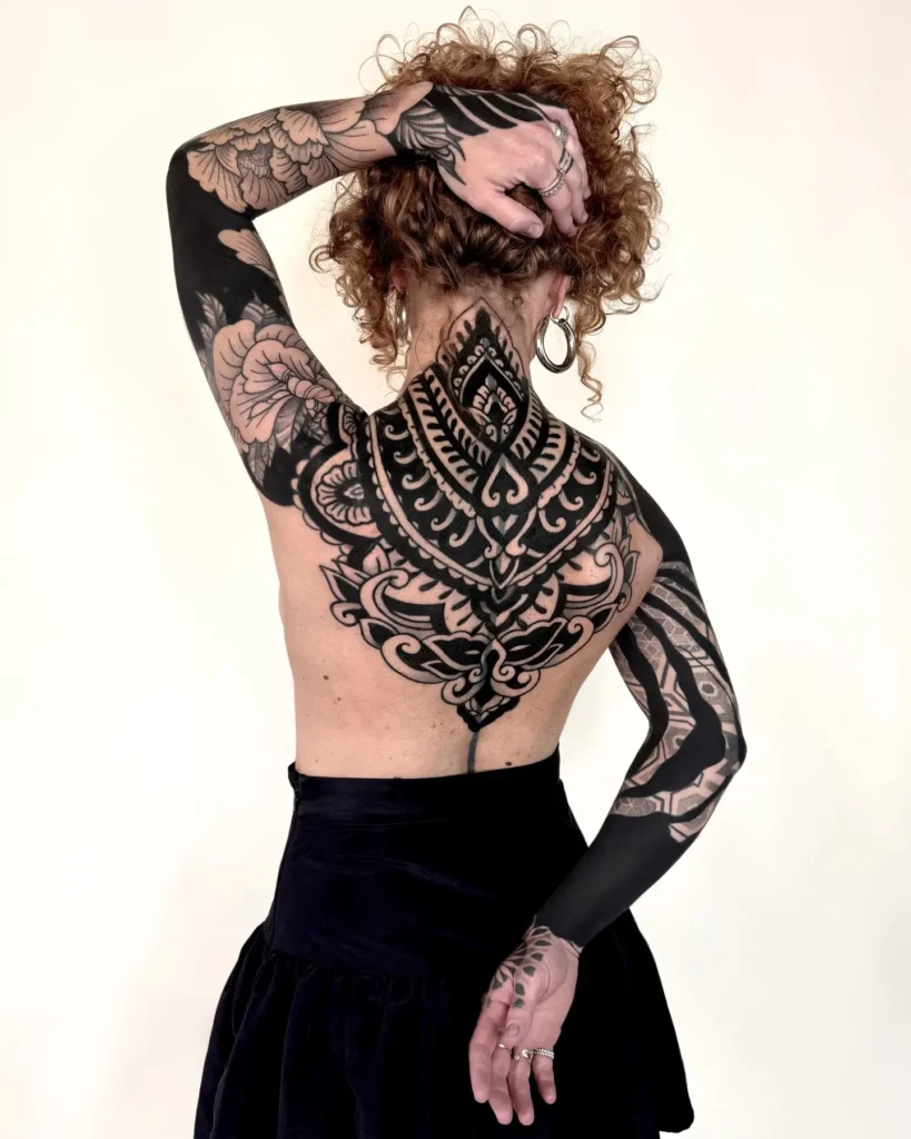 15. Full Back Mandala Tattoo with Blackwork Sleeves