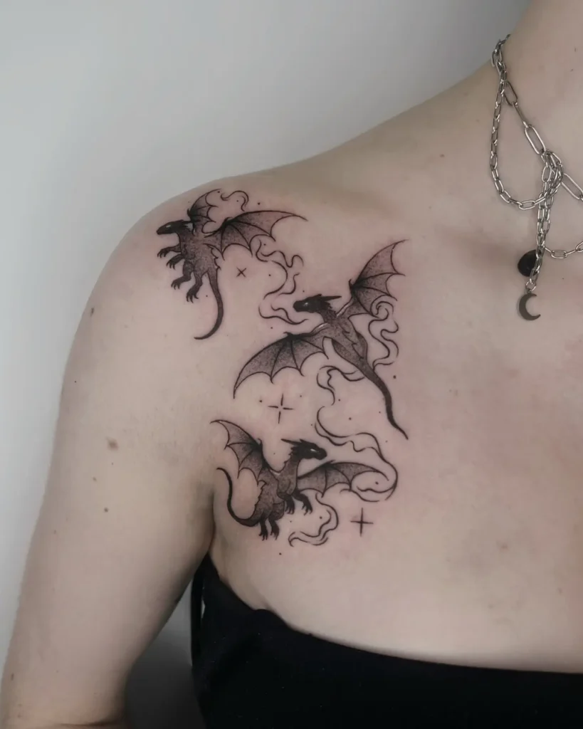 18. Baby Dragons Collarbone Tattoo
