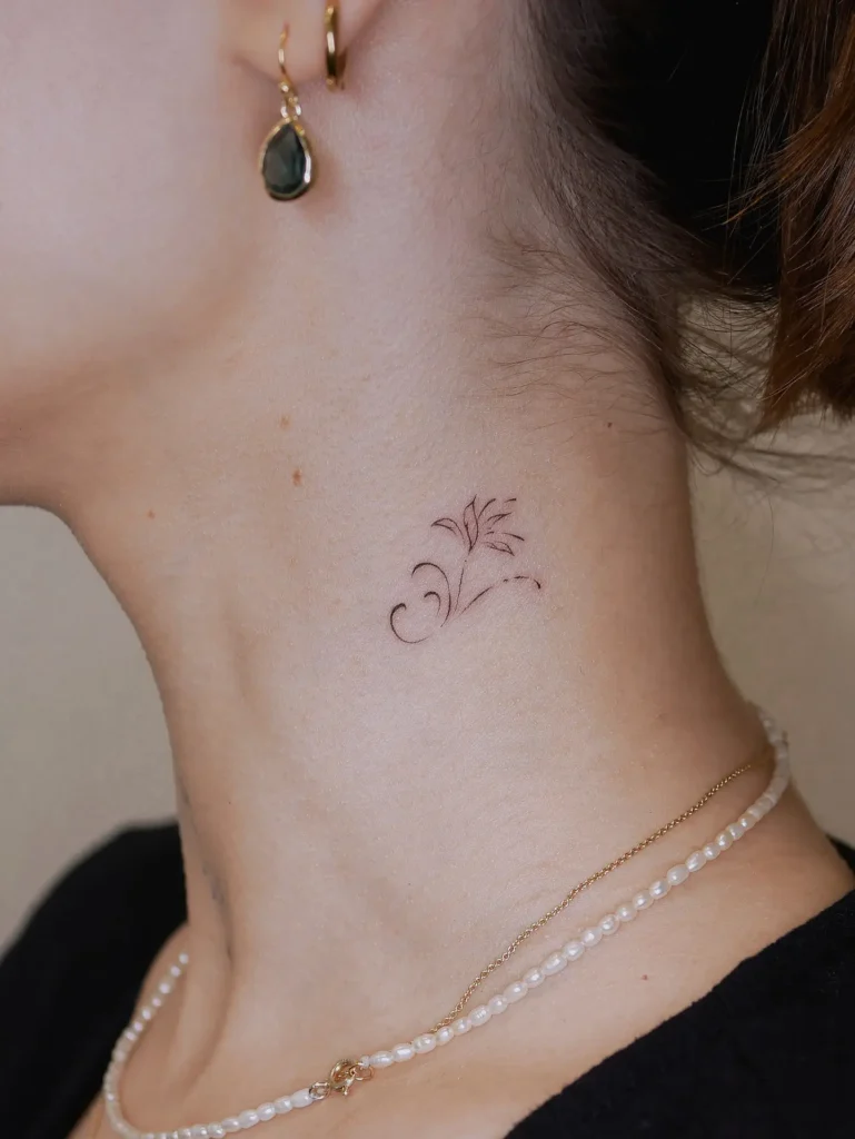 18. Elegant Neck Wave and Leaf Tattoo