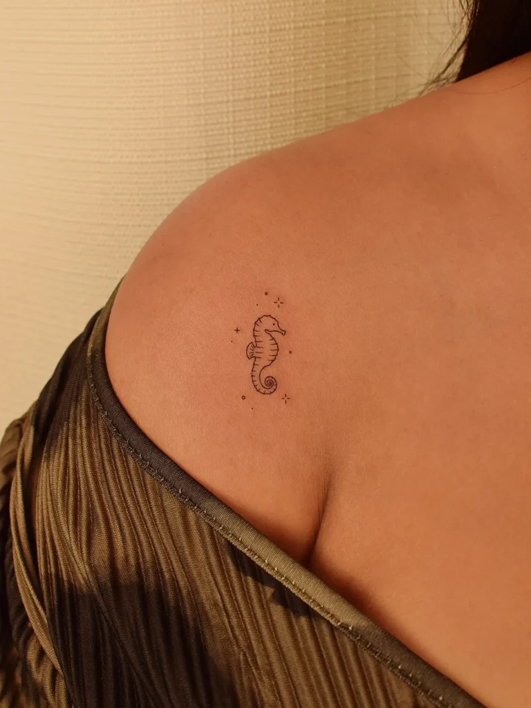 19. Tiny Seahorse with Sparkles Shoulder Tattoo
