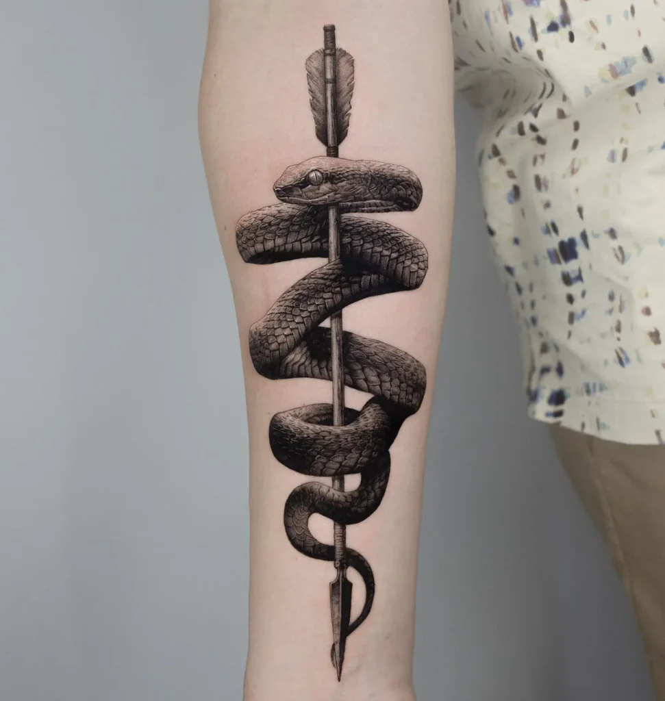 3. Snake Wrapped Around Arrow Tattoo