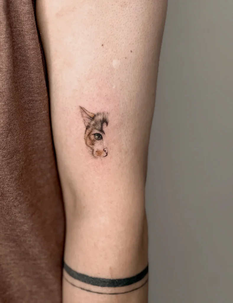 4. Tiny Realistic Cat Eye Tattoo