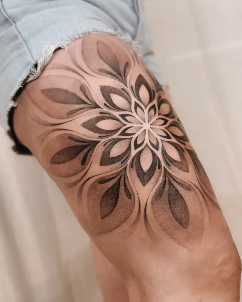 6. Bold Thigh Mandala Tattoo