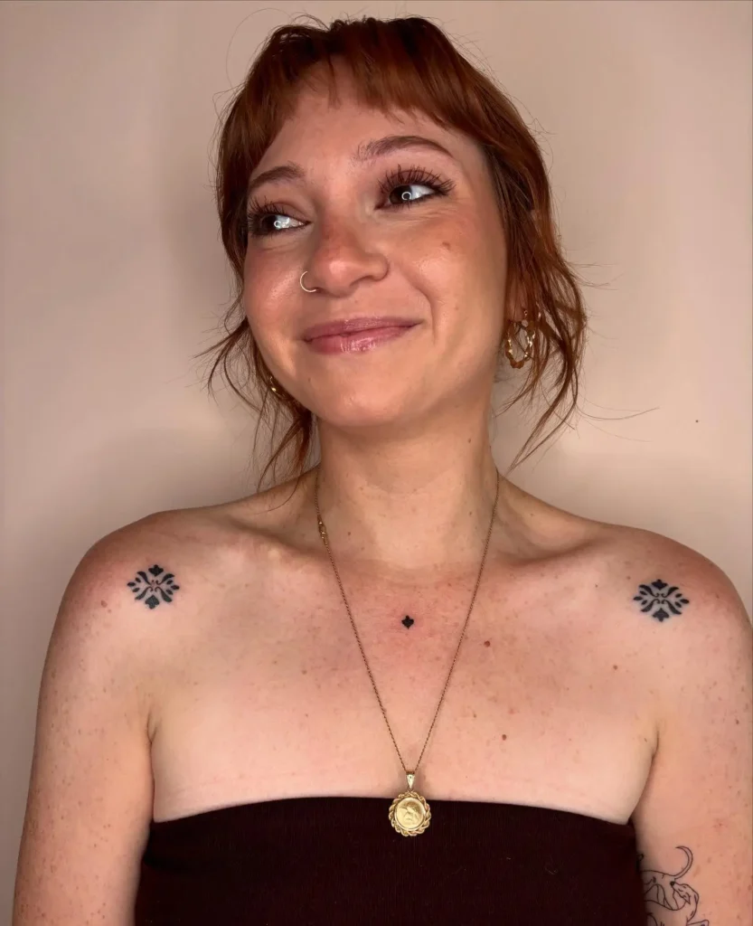 6. Symmetrical Floral Collarbone Tattoo