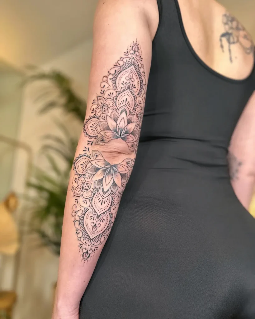 7. Lotus-Inspired Arm Mandala Tattoo