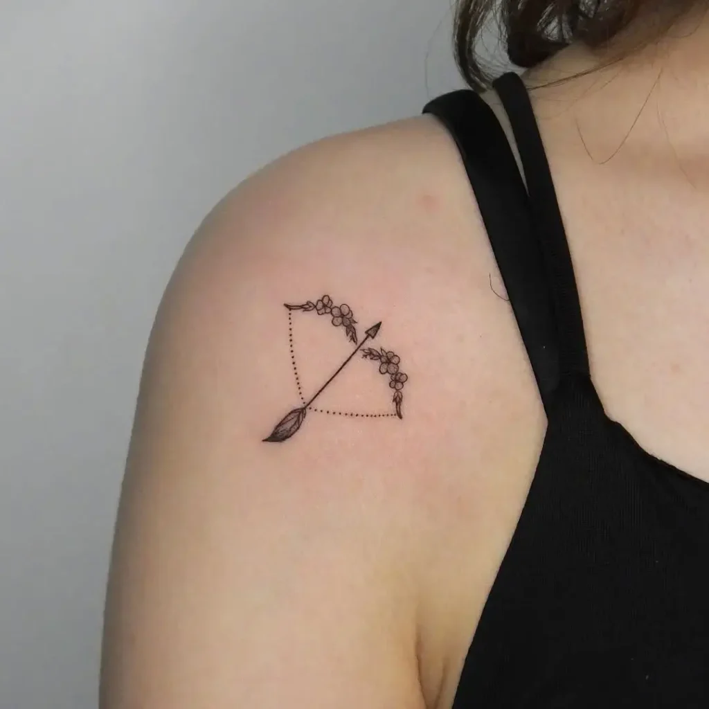 8. Floral Bow and Arrow Shoulder Tattoo