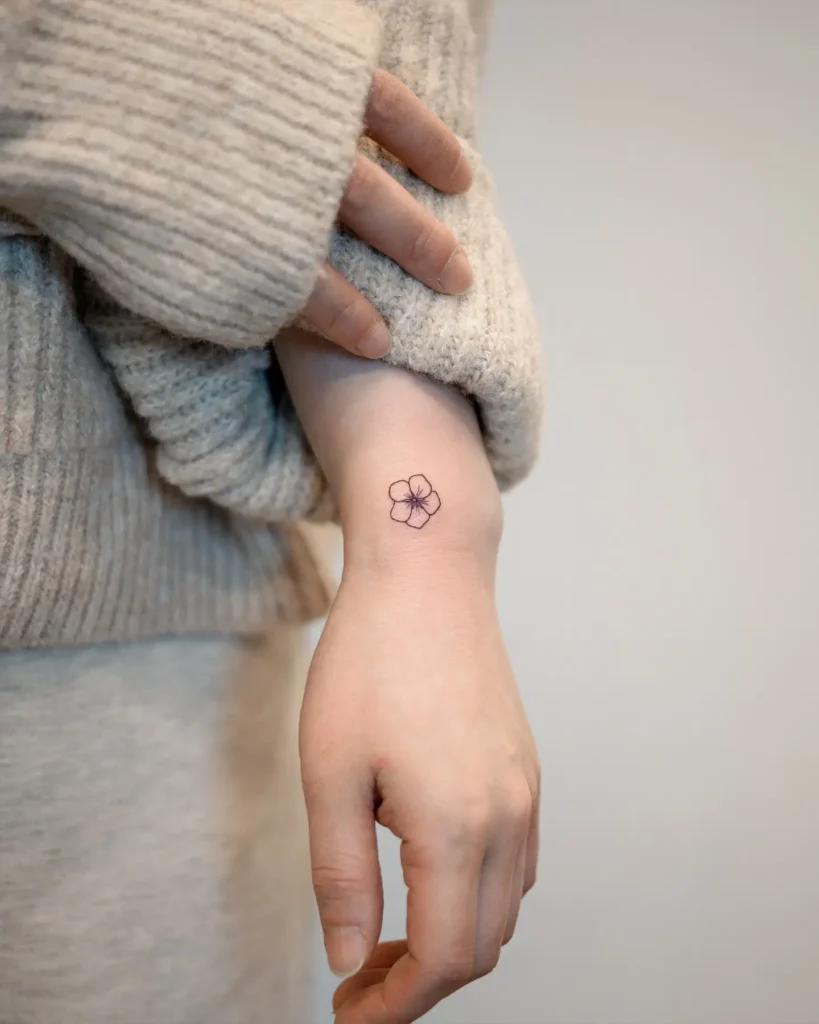 8. Single Line Flower Tattoo on Wrist