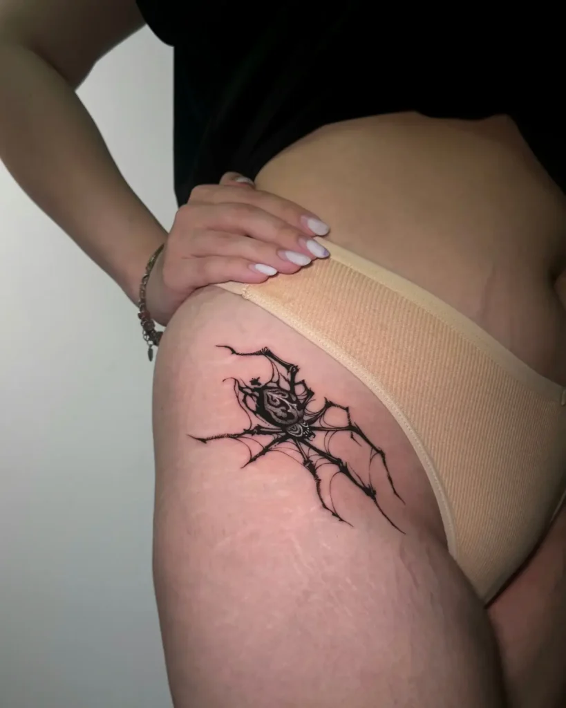 9. Dark Web Spider Hip Tattoo
