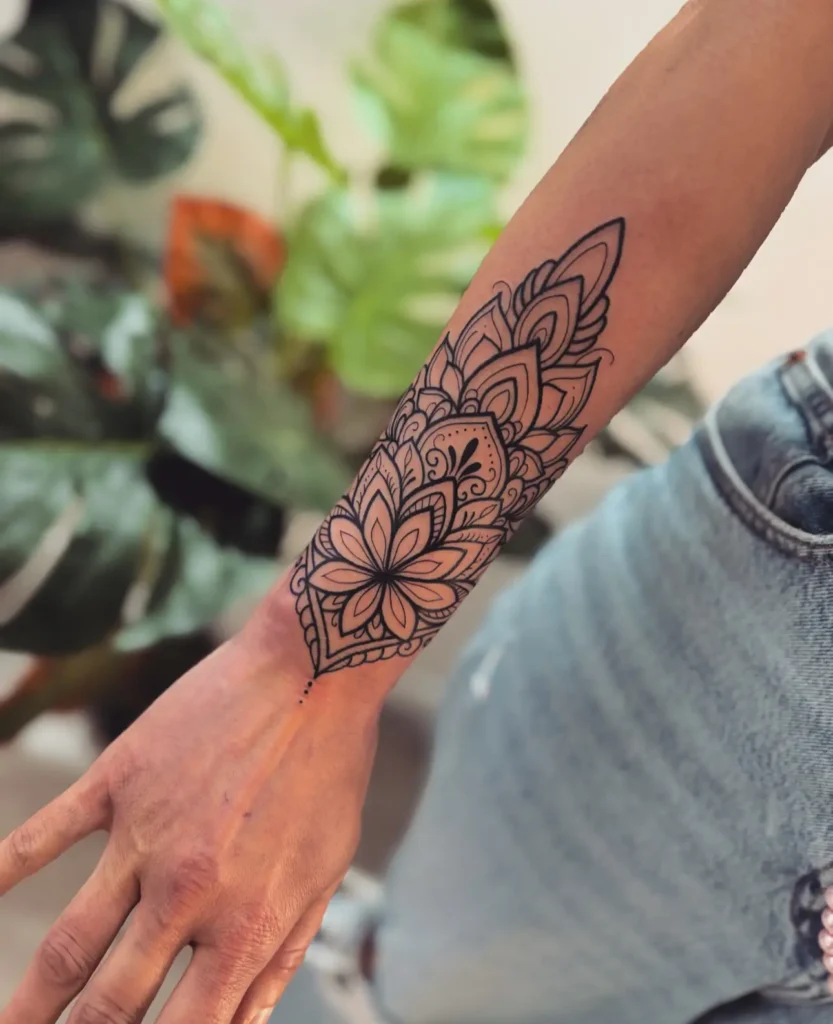 9. Elegant Forearm Mandala Tattoo