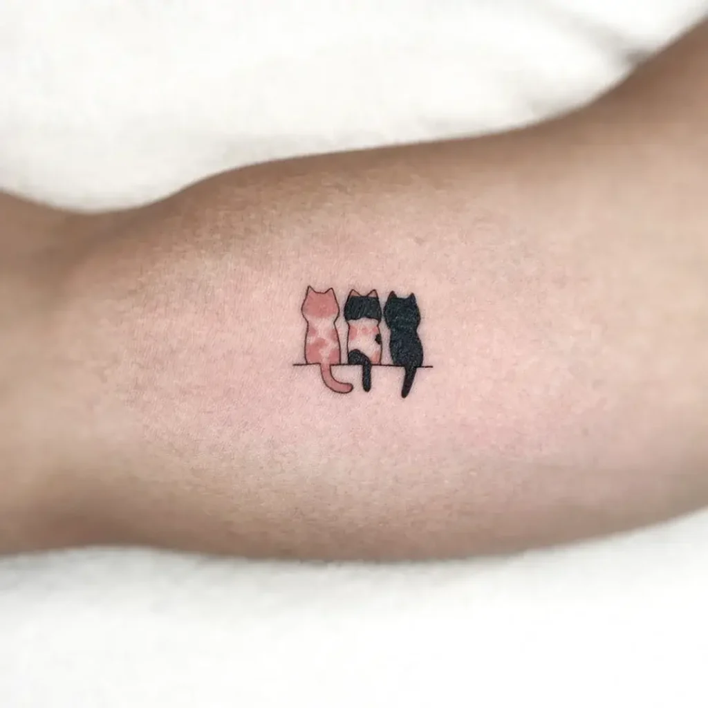 9. Three Cats on a Line Tattoo