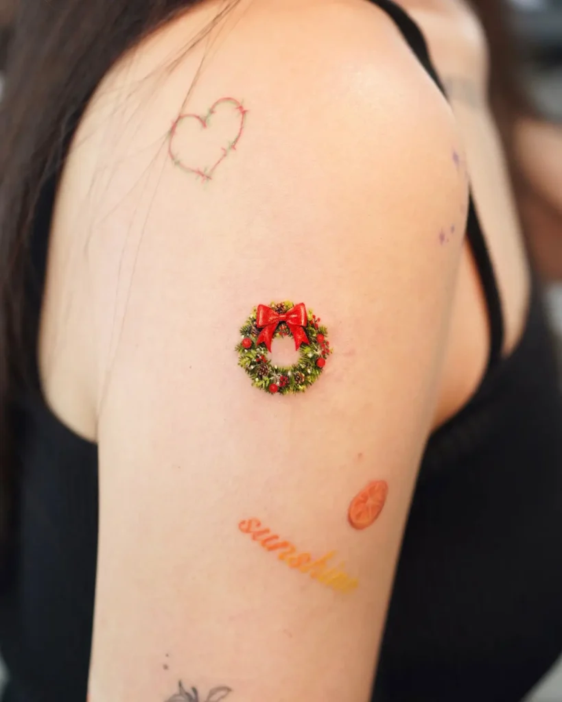 1. Mini Wreath Magic – Festive Shoulder Ink