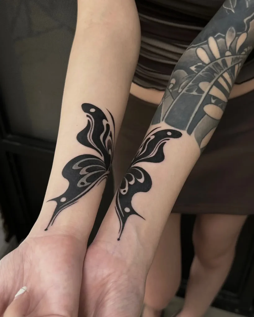 10. Split Butterfly Wrist Tattoo Cover Up