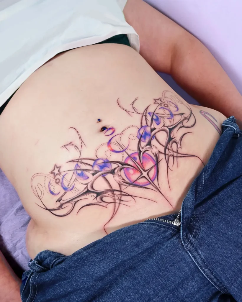 13. Neon Heart Script – Lower Stomach Y2K Tattoo