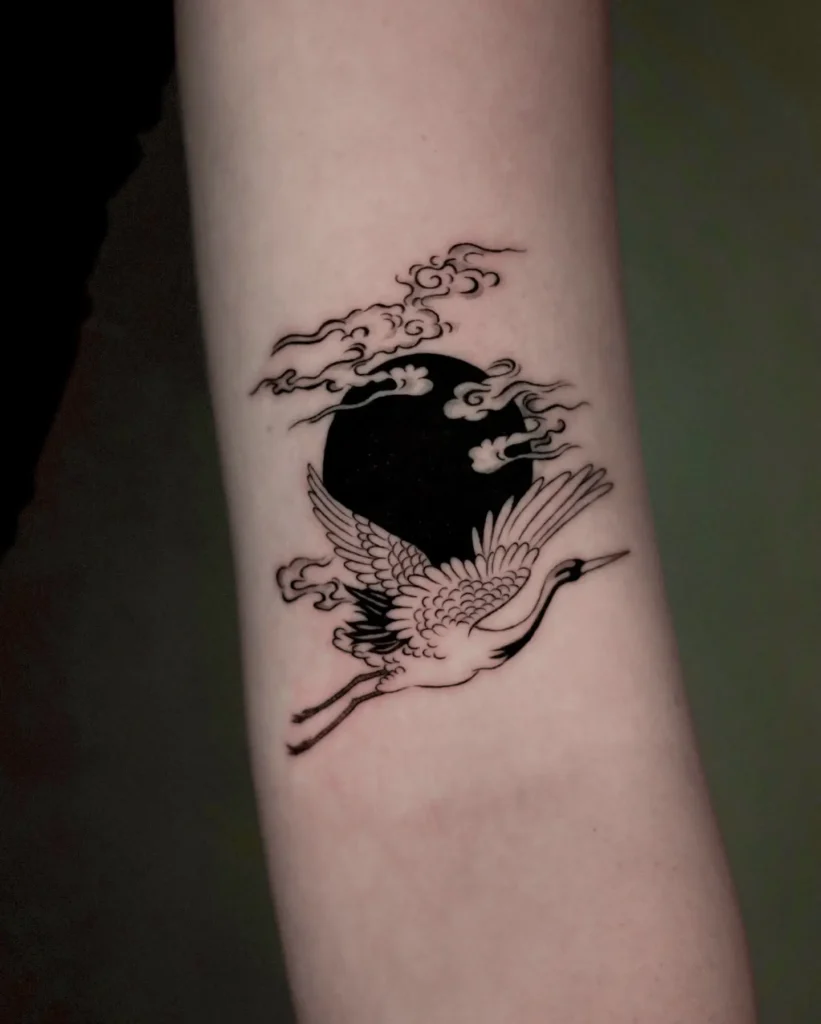 15. Crane and Black Moon Tattoo Cover Up
