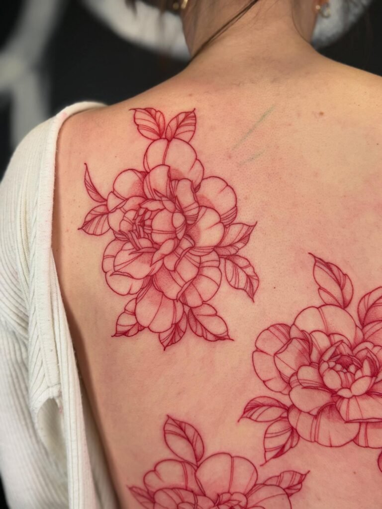 20. Camellia Blooms Red Ink Tattoo on Back