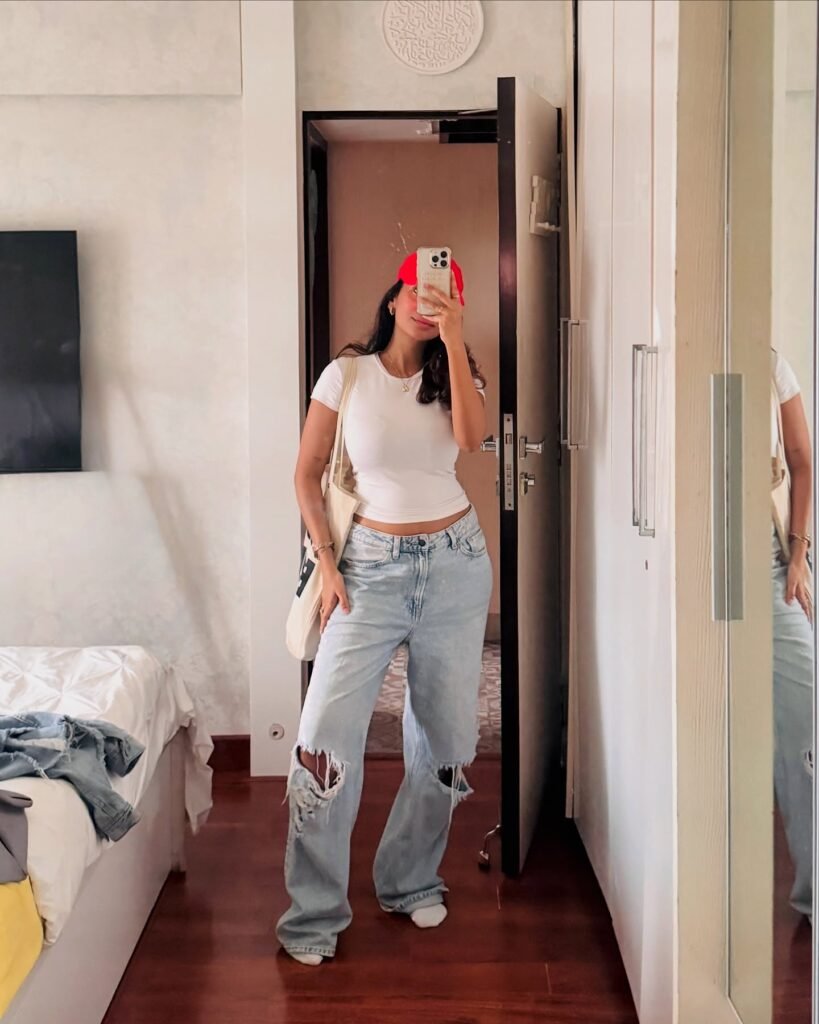 10. White Fitted Tee + Ripped Light Baggy Jeans