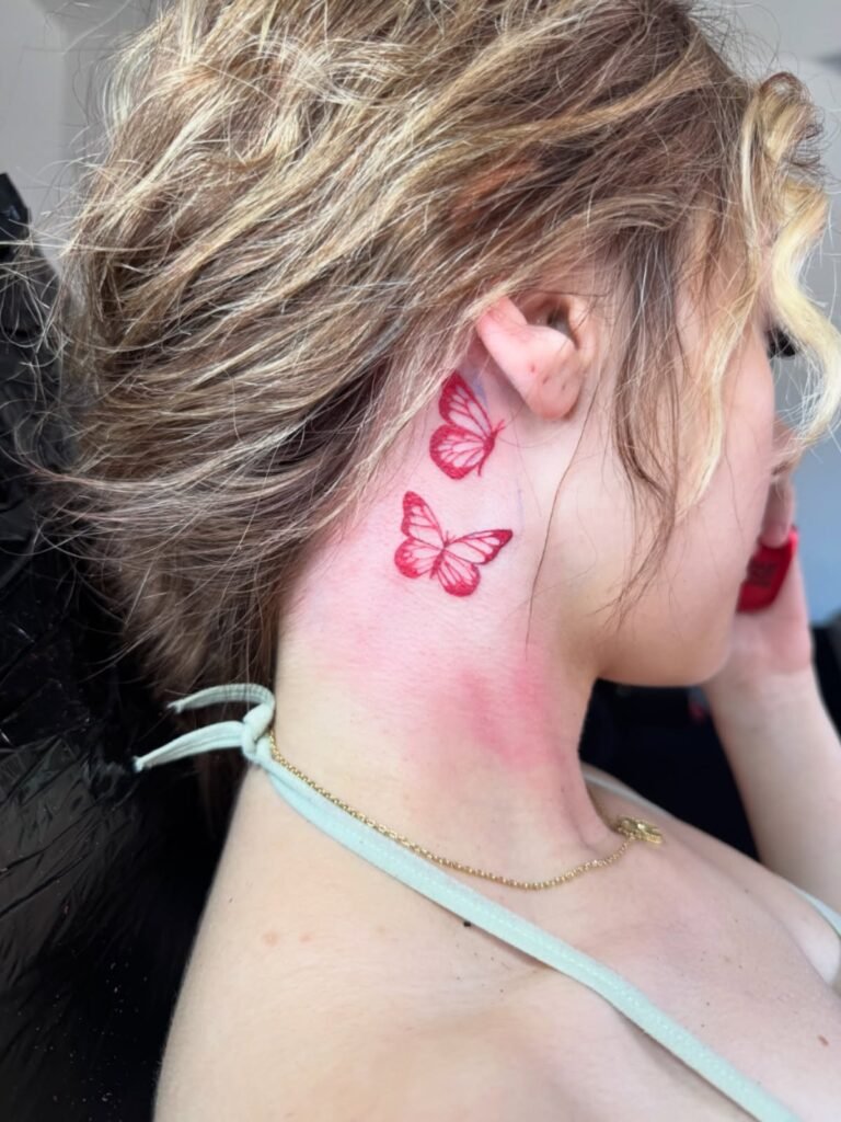 1. Twin Flight: Red Butterflies Behind the Ear